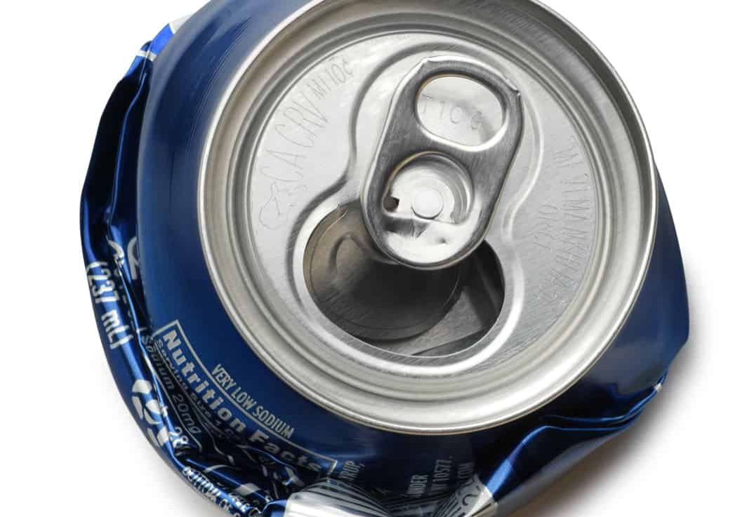 A crushed aluminum can ready for recycling. Clipping path included.